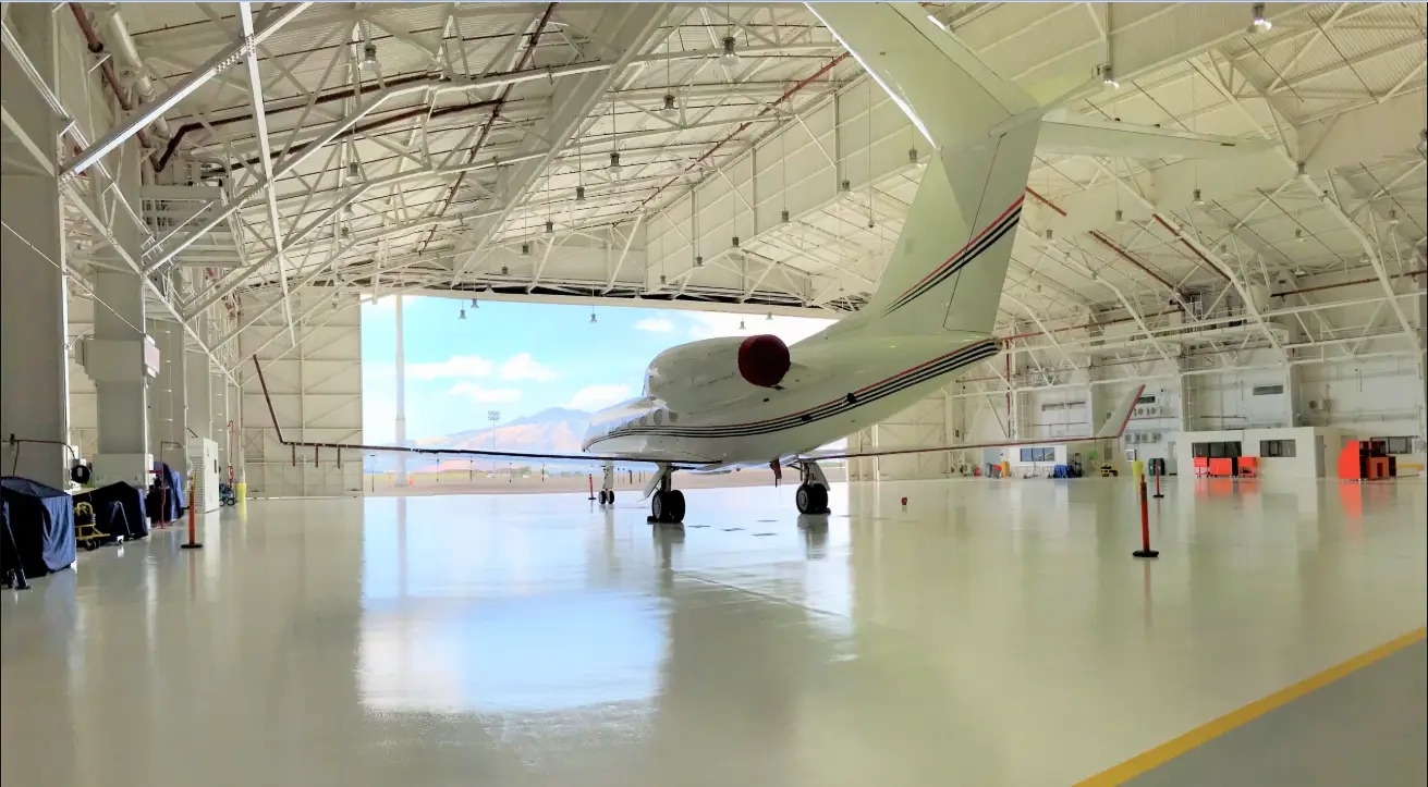 Aircraft engineers inspecting a modern commercial aircraft during maintenance